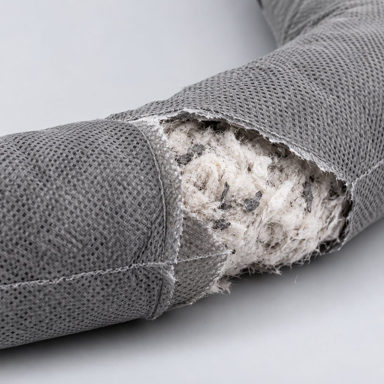 Universal absorbent sock outer skin and absorbent core detail