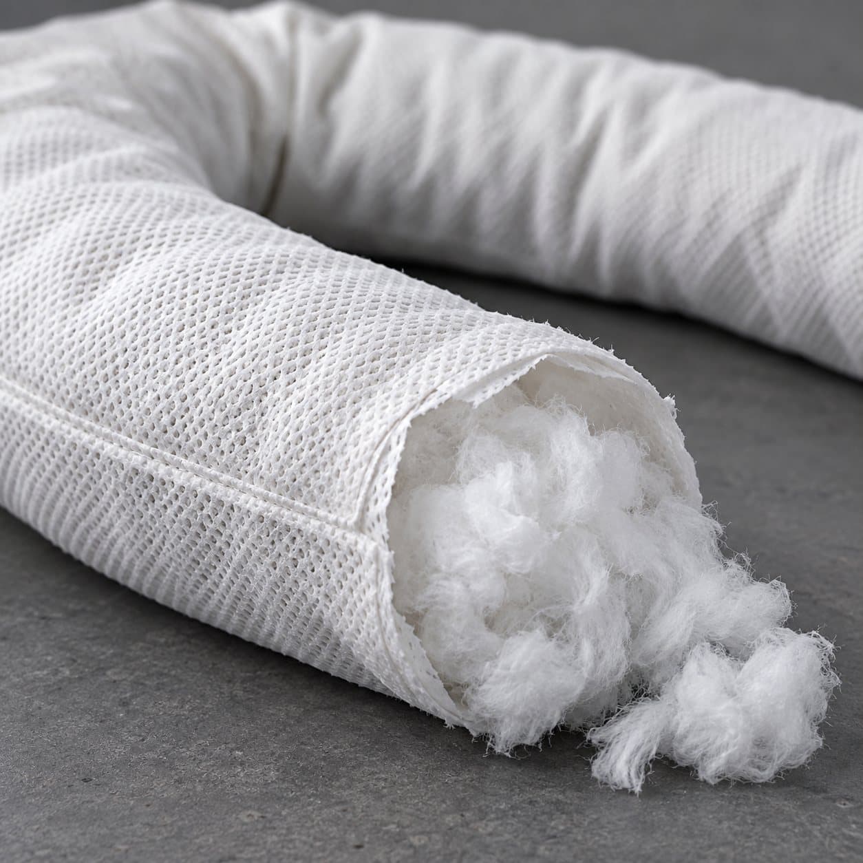 Oil-only absorbent sock outer skin and absorbent core detail